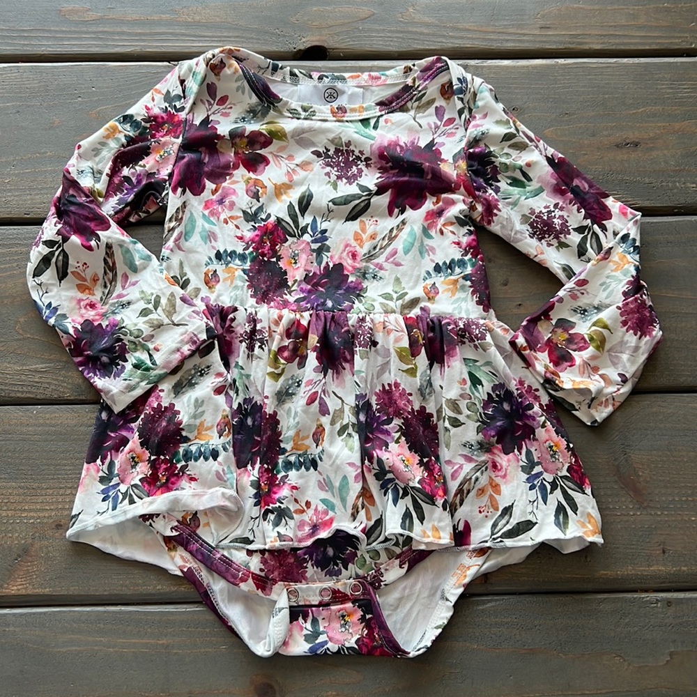 Skirted onesie with floral print